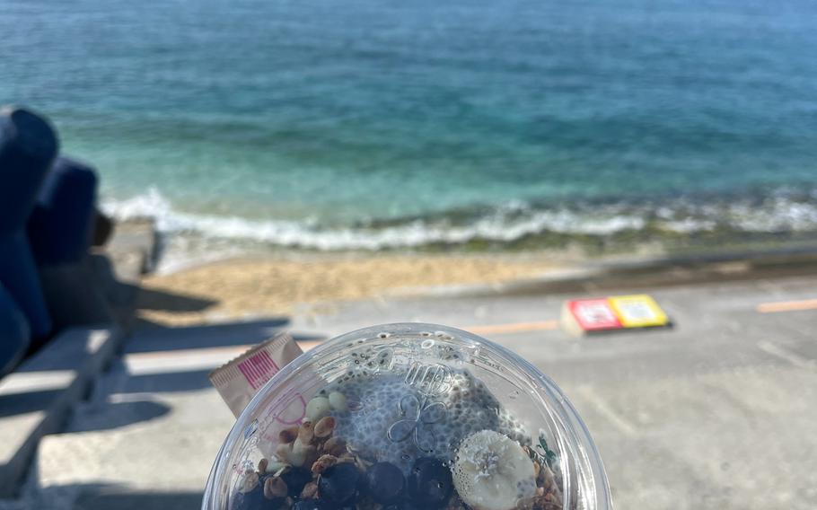 Eating Acai Bowl at the coastline.